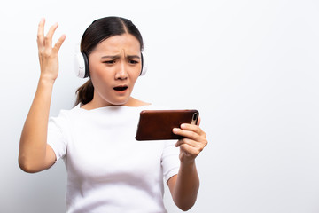 Angry woman playing to the game from smartphone