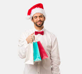 Young man wearing a santa claus hat on Christmas day