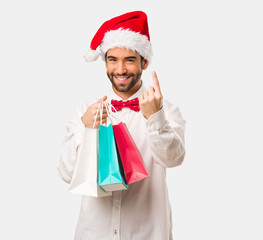 Young man wearing a santa claus hat on Christmas day