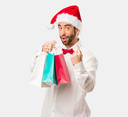 Young man wearing a santa claus hat on Christmas day