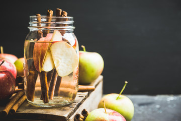Apple and cinnamon detox drink in jar. Selective focus.