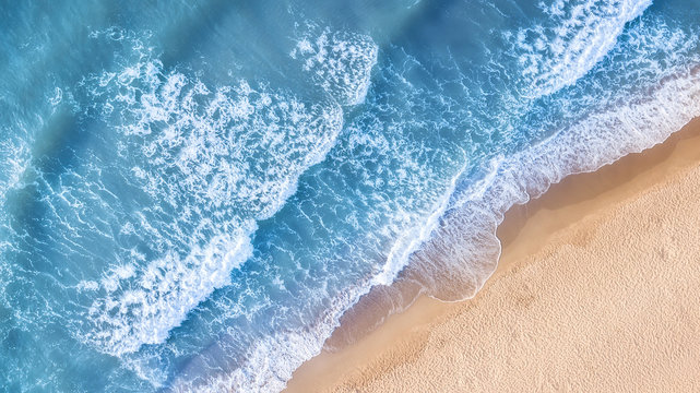 Beach and waves from top view. Aerial view of luxury resting at sunny day. Summer seascape from air. Top view from drone. Travel-image