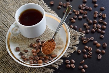 Fragrant coffee in a white Cup on a burlap.