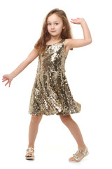 A cheerful little girl is dancing.