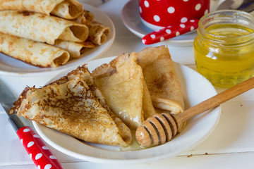 A stack of pancakes with and honey for Maslenitsa