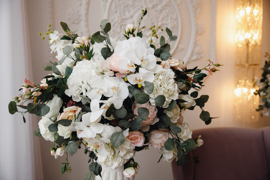 Artificial flowers in bouquet, real sensations, on white background