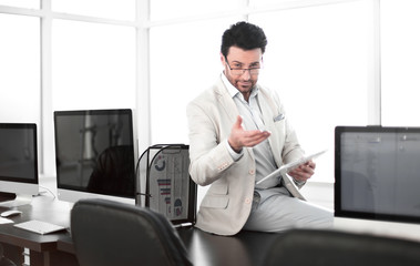 responsible businessman with digital digital tablet in modern office