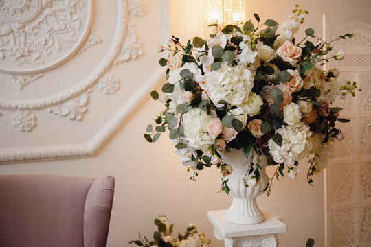 Artificial flowers in bouquet, real sensations, on white background