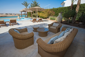 Obraz premium Swimming pool at at luxury tropical holiday villa