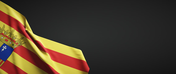 Bandera de Aragónde tela sobre fondo oscuro