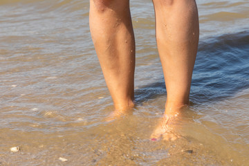 Fototapeta na wymiar feet at beach north sea