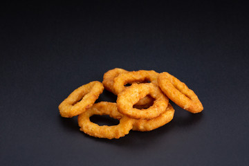 Deep Fried squid rings on the black background