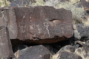 Ancient Native American rock art along the Rinconada Trail in Petroglyph National Monument,...
