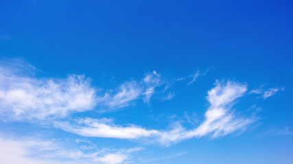 Naklejka na ściany i meble Clouds on a blue sky as background