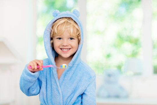 Child brushing teeth. Kids tooth brush.