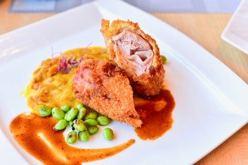Baked Chicken Cordon Bleu with Pumpkin Sauce and Green Peas