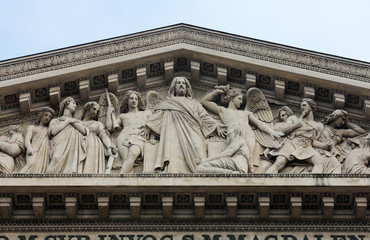 Fototapeta premium The sculpted tympanum of the church 