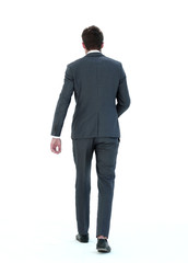 rear view. the young businessman goes forward