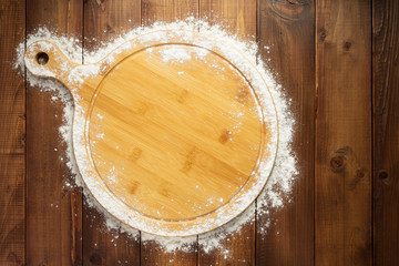 wheat flour on wooden background