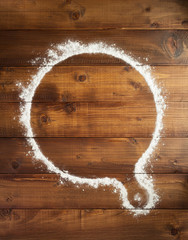 wheat flour on wooden background