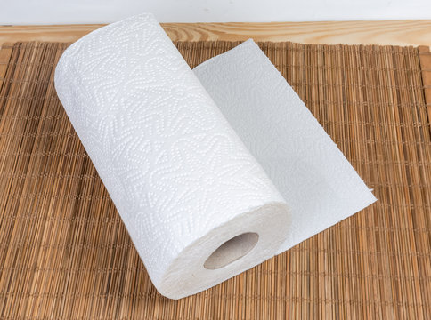 Roll of paper towels on the bamboo table mat