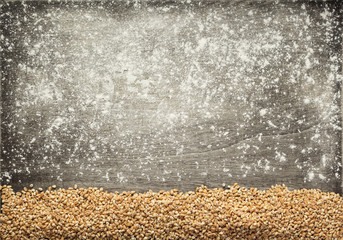 wheat grains at wooden background