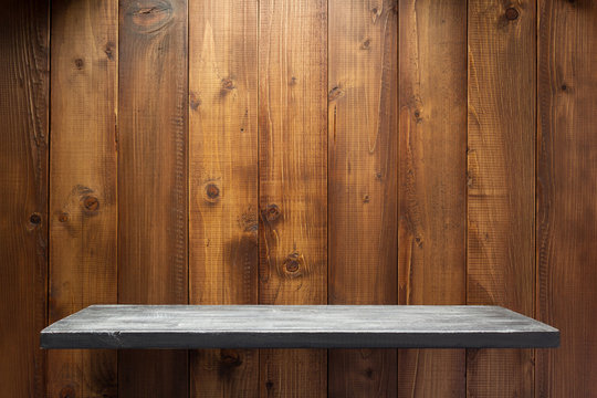wooden shelf at wall plank background