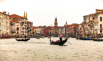 Italy beauty, gondolas near to famous Rialto bridge on Grand canal street in Venice , Venezia