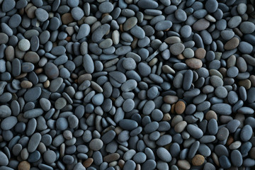 Fototapeta na wymiar Abstract background texture sea stones, top view