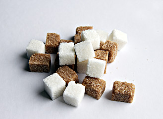 Pieces of sugar on a light background
