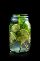 Lime, mint and ginger detox drink in jar. Selective focus.