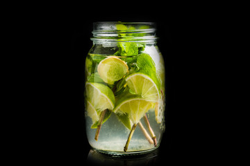 Lime, mint and ginger detox drink in jar. Selective focus.