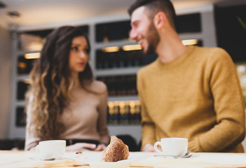 Focus on a croissant during breakfast.