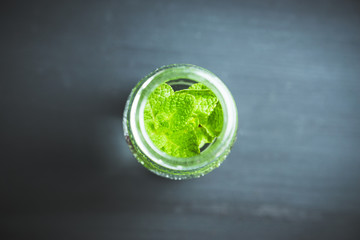 Mint detox drink in small bottle. Selective focus. 