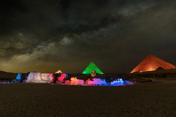 Giza pyramids and Sphinx light up at night - obrazy, fototapety, plakaty