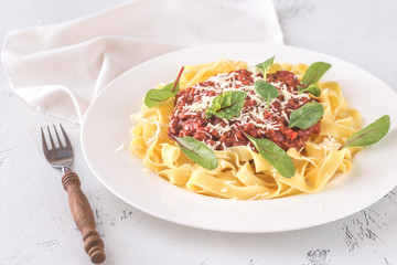 Portion of tagliatelle with bolognese sauce