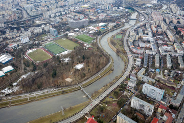 Fototapeta na wymiar Aerial above view of river crossing the city