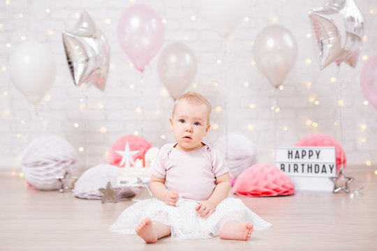 first birthday - cute little baby girl in birtday decorations