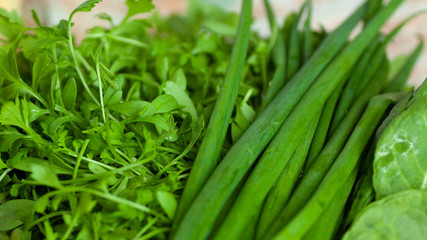Vegan healthy fresh green onion and leafs watercress. Food background. Vitamin diet.