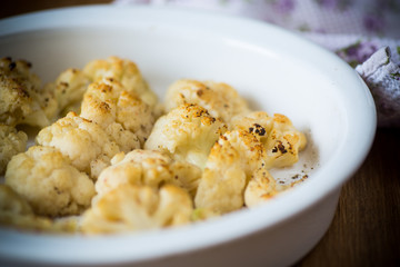 baked cauliflower with spices in ceramic form