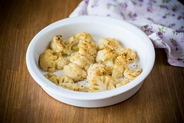 baked cauliflower with spices in ceramic form