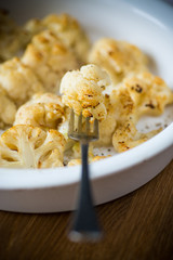 baked cauliflower with spices in ceramic form