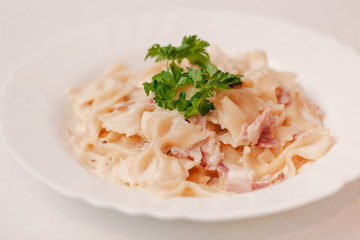 European international fusion cuisine, a beautiful dish on a white plate decorated with herbs and vegetables. a professional chef has prepared a delicious meal.