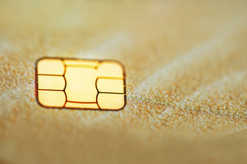 Gold credit card with micro chip selective focus
