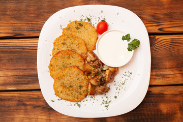 European international fusion cuisine, a beautiful dish on a white plate decorated with herbs and vegetables. a professional chef has prepared a delicious meal.
