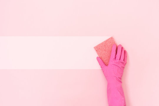 Woman holding small soft sponge for washing in her hands