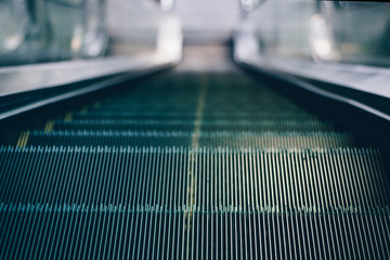 close up mechanical escalators for people up and down access detail