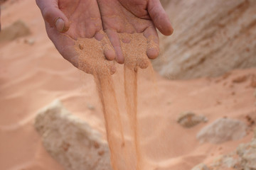 red sand on hand