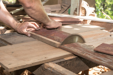 The man use a machine to cut. Circular saw, Power saw , Machine Electronic Table Saw, Sharp Cut Metal Steel Silver in Carpentry Wood Work