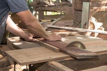 The man use a machine to cut. Circular saw, Power saw , Machine Electronic Table Saw, Sharp Cut Metal Steel Silver in Carpentry Wood Work